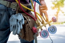 HVAC Technician Servicing System in Conyers