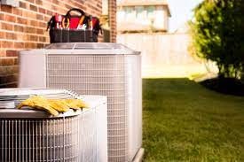 HVAC Technician Servicing System in Lithonia